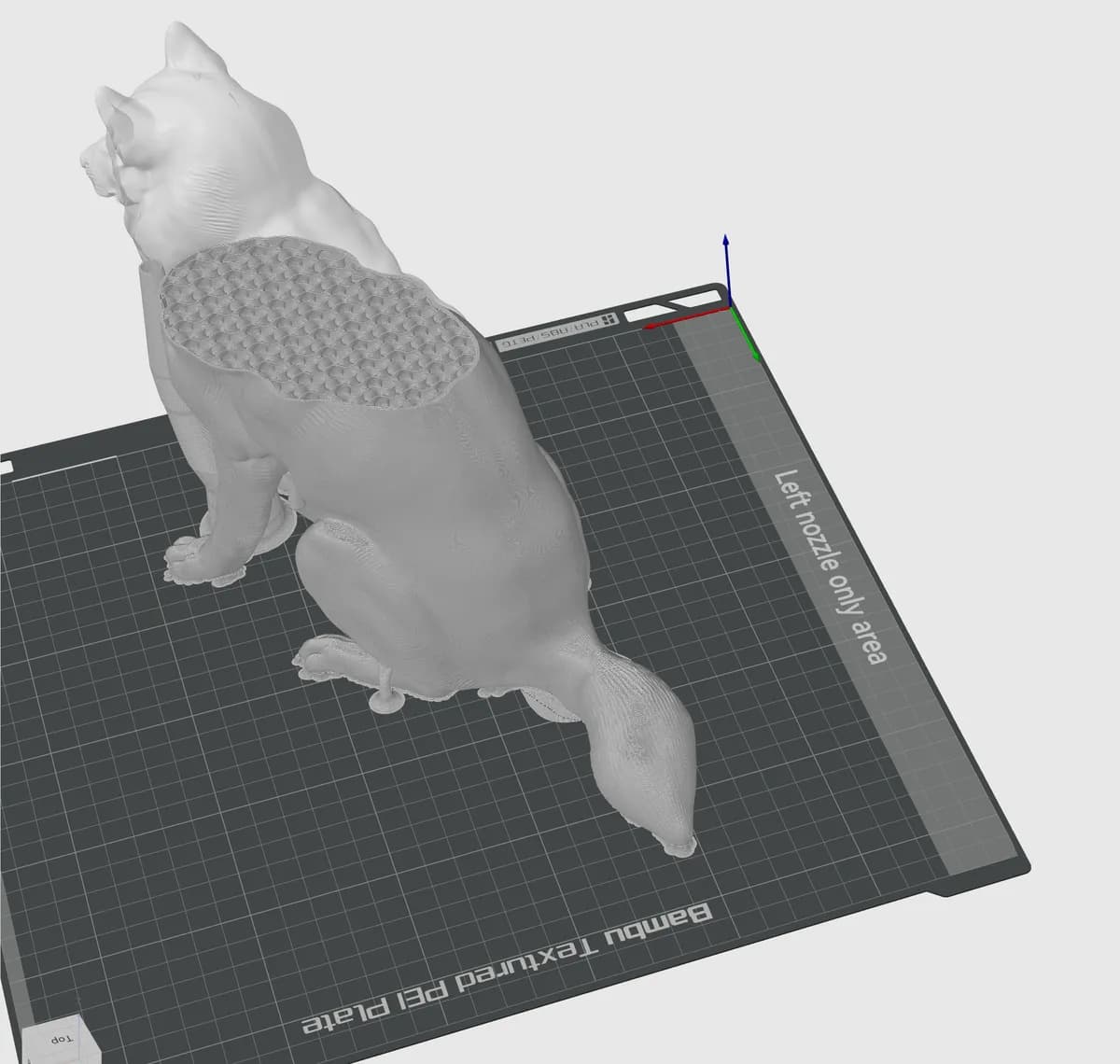 The dog model in slicer software on a printer bed, with a honeycomb-like infill visible.